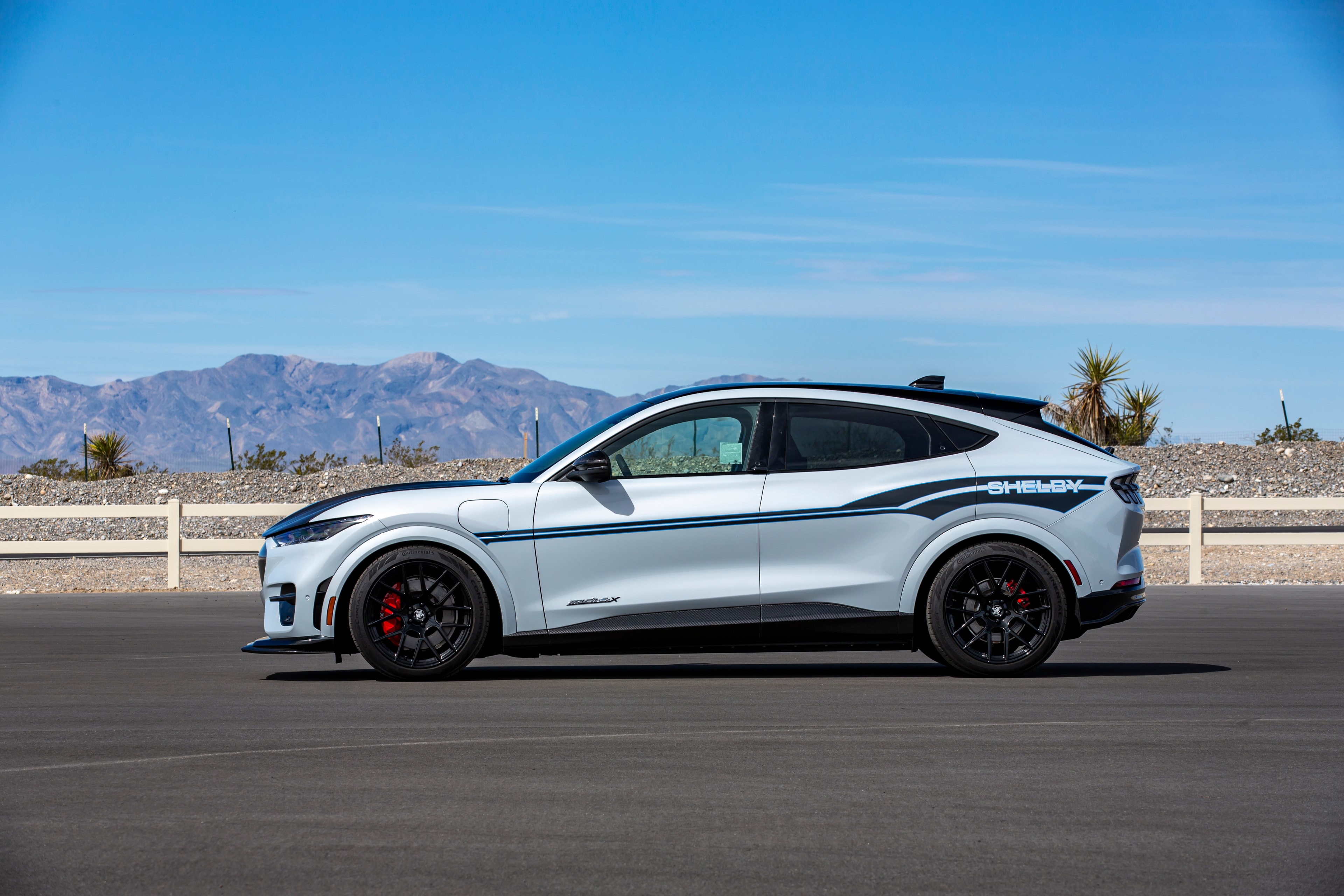 Shelby Mach-E GT side profile with electric blue vinyl striping